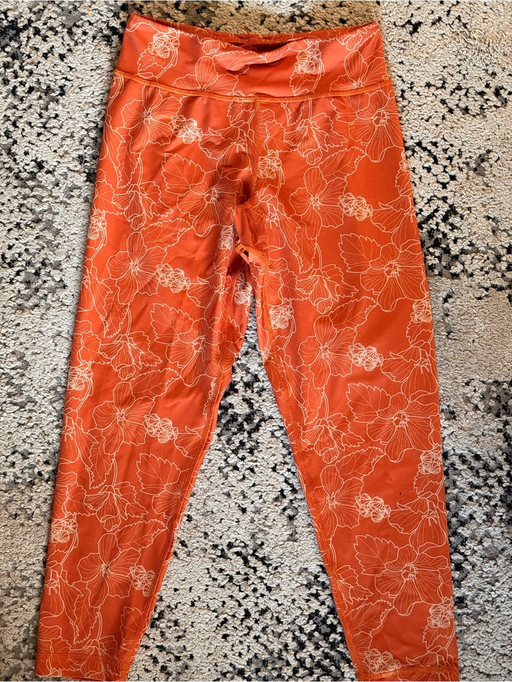 Orange hau flower workout pants